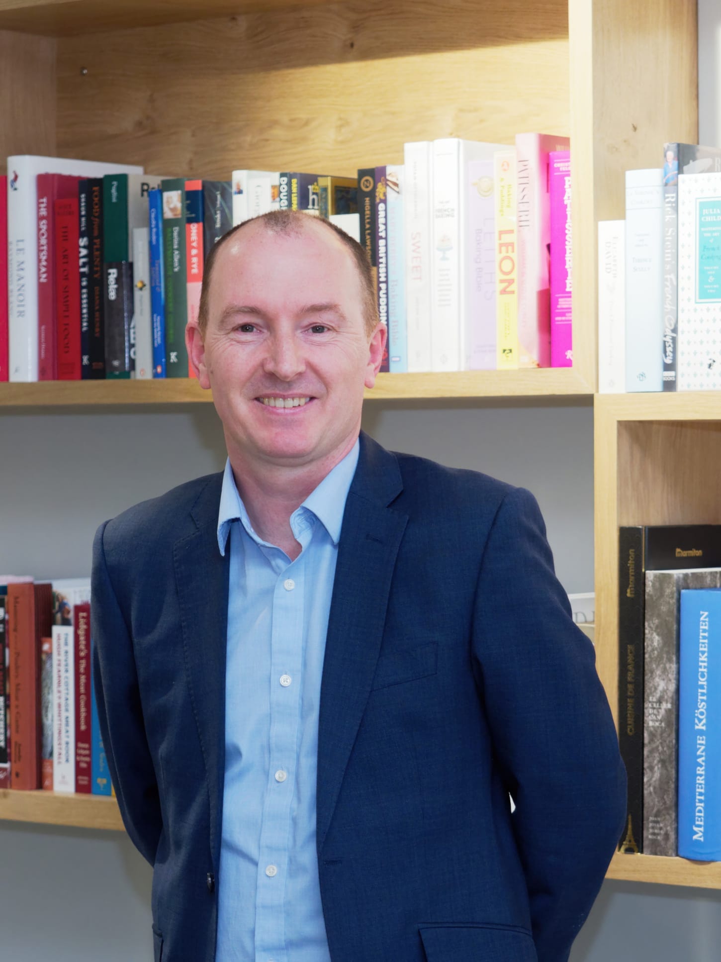 Two apetito colleagues working together in a yellow and grey private meeting booth