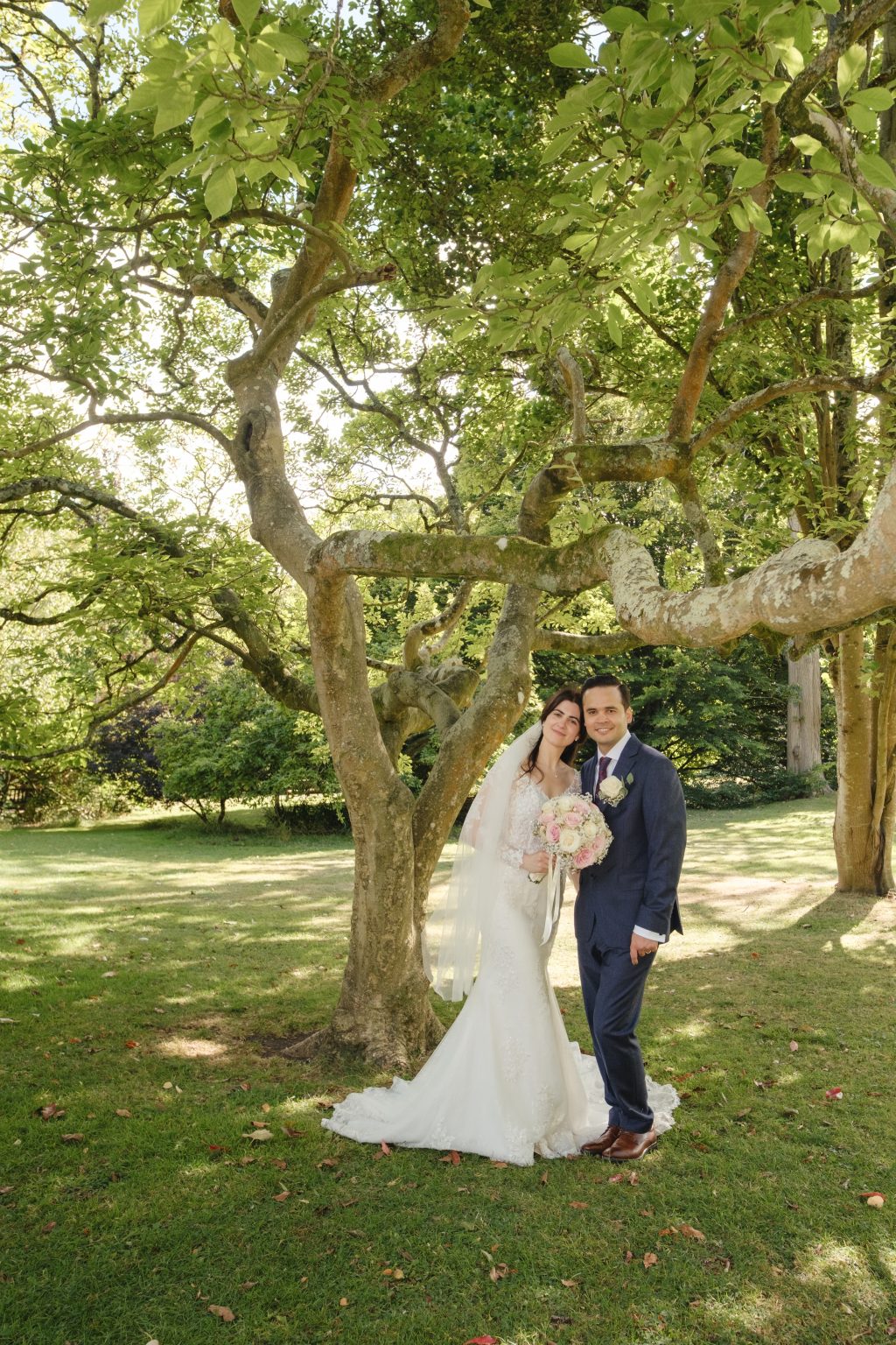 Habibi and Elaina together beneath the spreading branches of a tree in Bath’s Botanical Gardens.